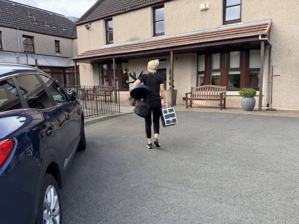 Jackie arriving at a care home for ear wax removal visits