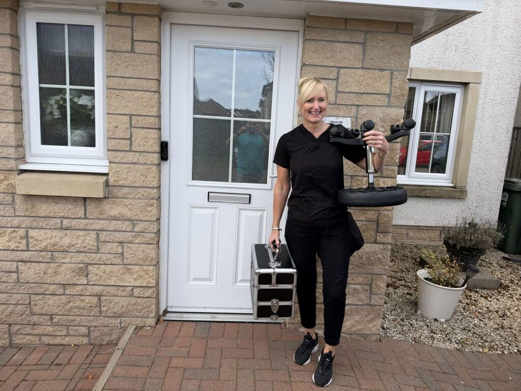 Jackie arriving for a home visit with her equipment