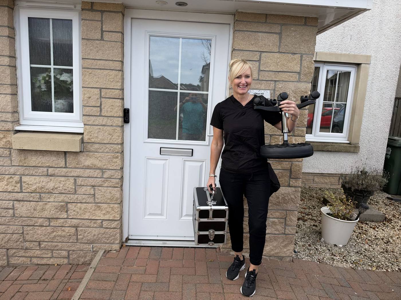 Jackie arriving for a home visit with her equipment
